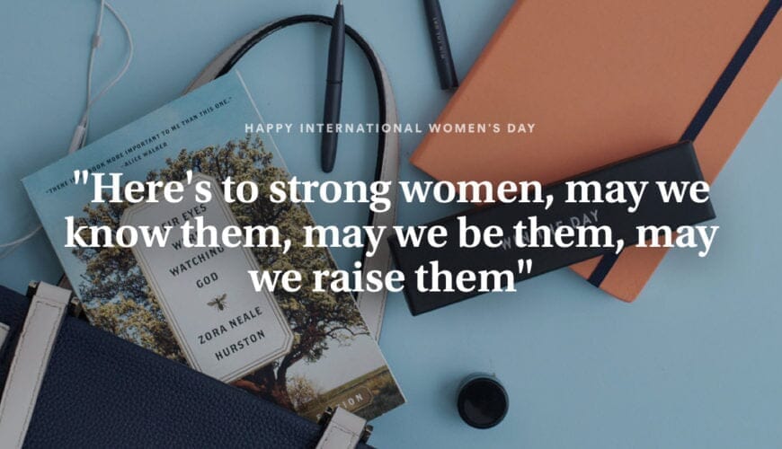 woman writing in journal with women empowerment quote text overlay